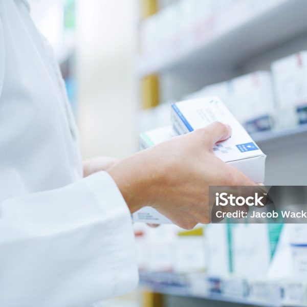 Doctor, hands or shelf with medication at pharmacy for inventory, stock or pharmaceutical service. Closeup, healthcare employee or pharmacist with box or medical product for side effect at drug store